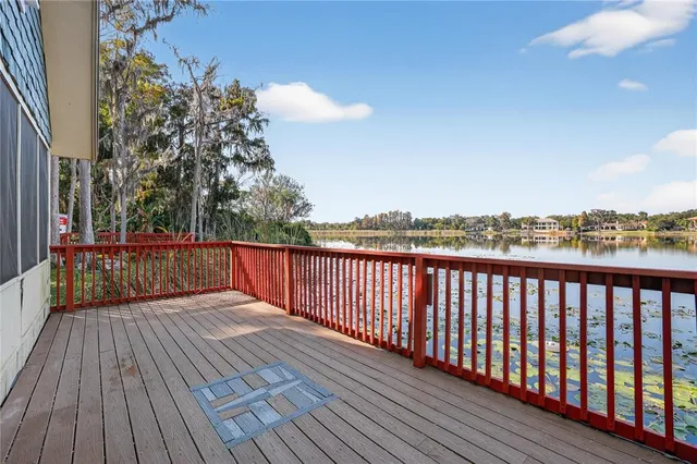 a balcony with wooden floor in front of it