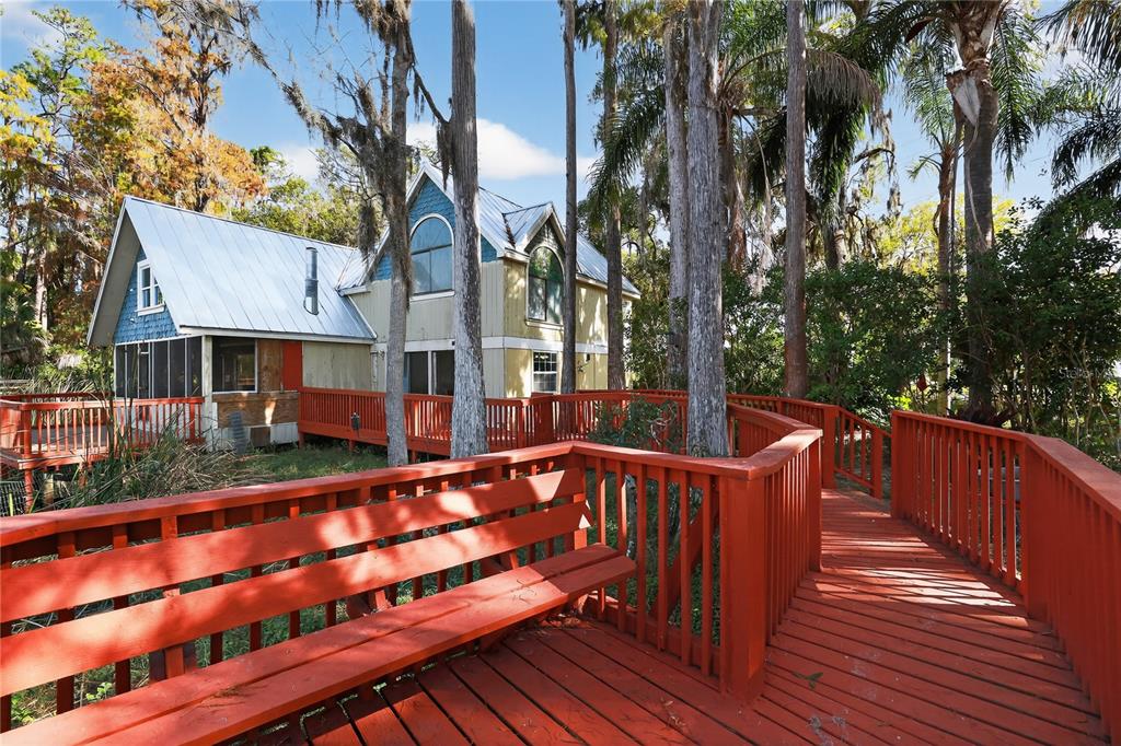 8111 North Mobley Road Odessa, FL 33556 - Photo 12 of 42 a view of a wooden deck with a yard