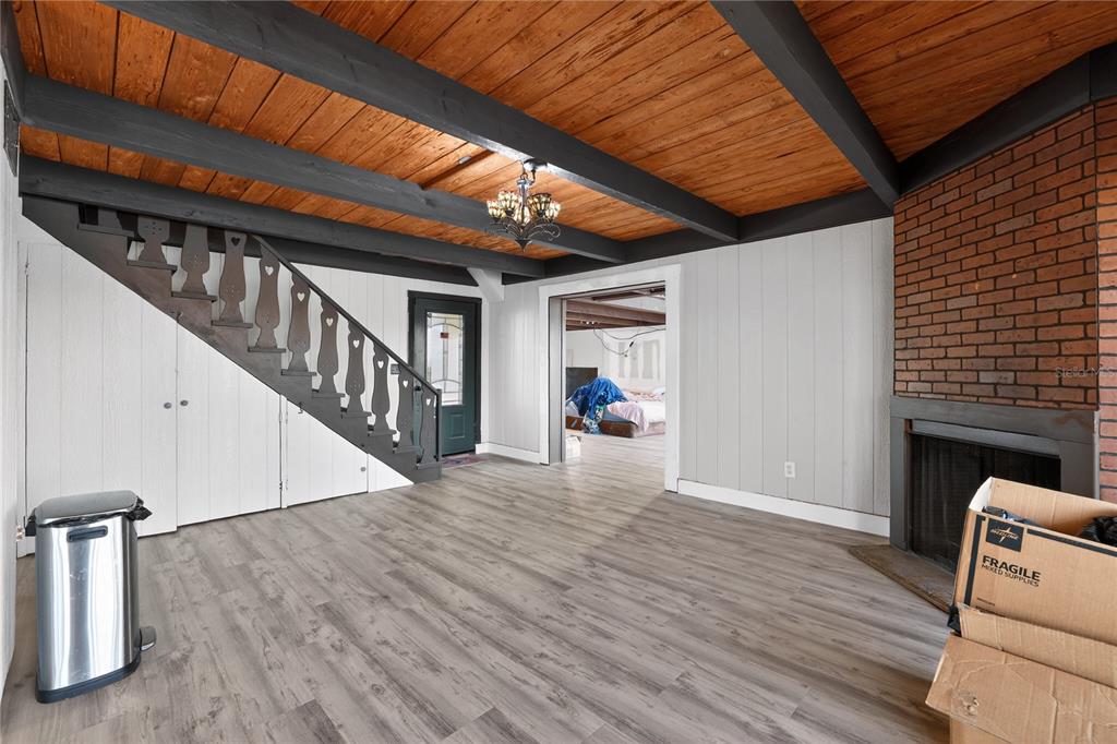 8111 North Mobley Road Odessa, FL 33556 - Photo 16 of 42 a view of a livingroom with wooden floor and stairs