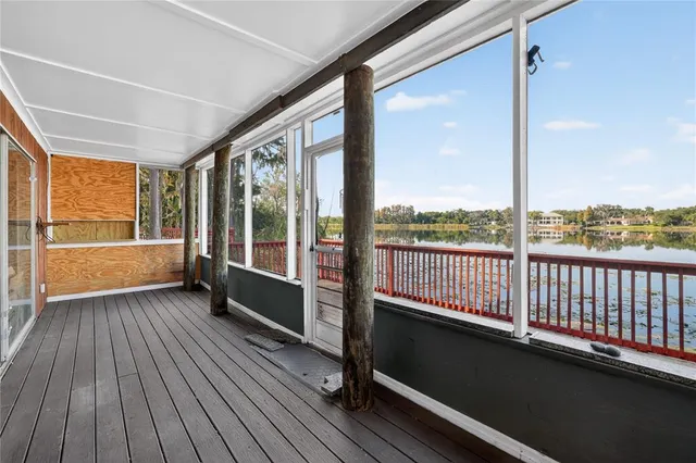 a view of a balcony with wooden floor