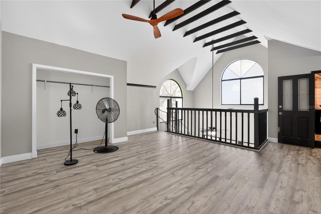 8111 North Mobley Road Odessa, FL 33556 - Photo 30 of 42 a view of a hallway with wooden floor