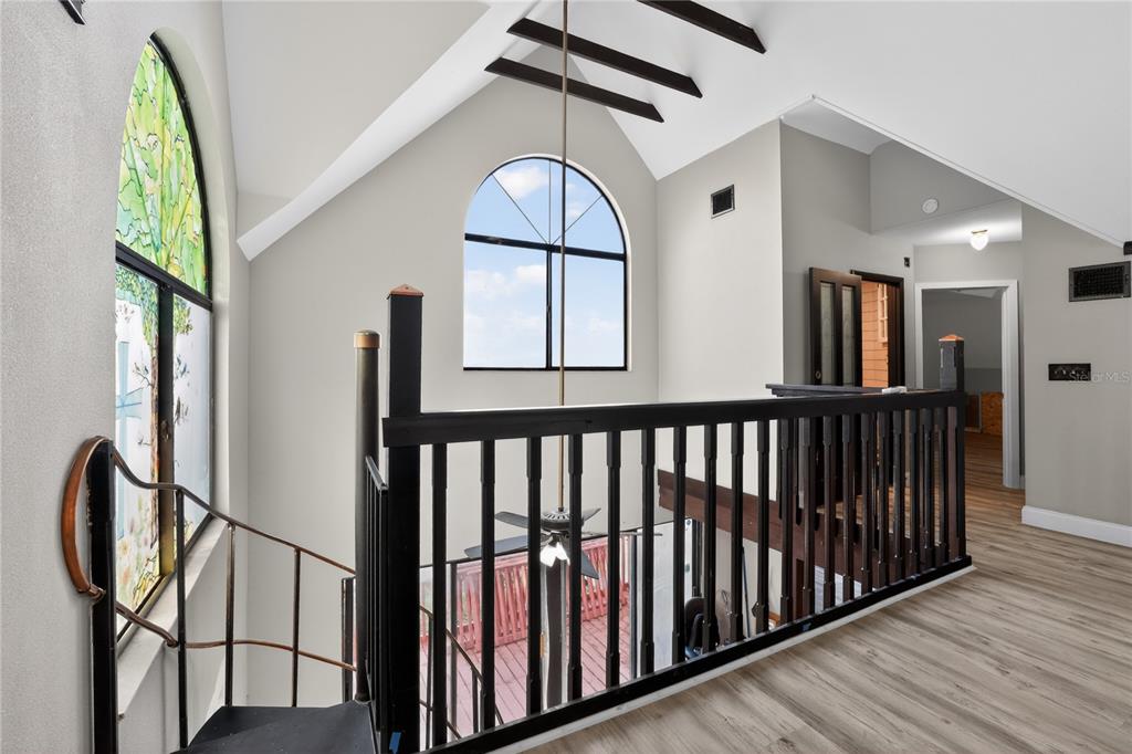 8111 North Mobley Road Odessa, FL 33556 - Photo 31 of 42 a view of staircase with wooden floor and a window