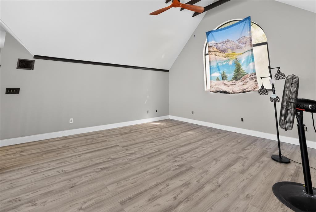 8111 North Mobley Road Odessa, FL 33556 - Photo 32 of 42 a view of a room with wooden floor and windows