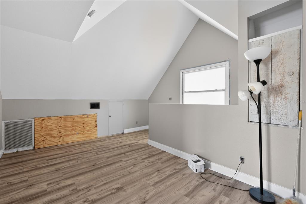 8111 North Mobley Road Odessa, FL 33556 - Photo 41 of 42 a view of empty room with wooden floor and fan