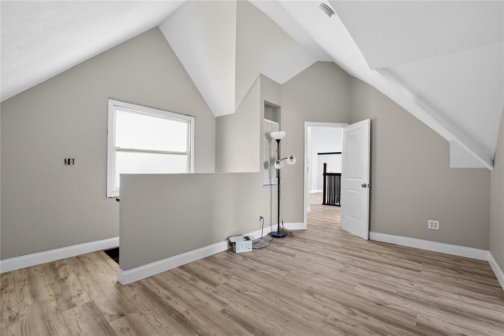 8111 North Mobley Road Odessa, FL 33556 - Photo 42 of 42 a view of empty room with wooden floor and fan