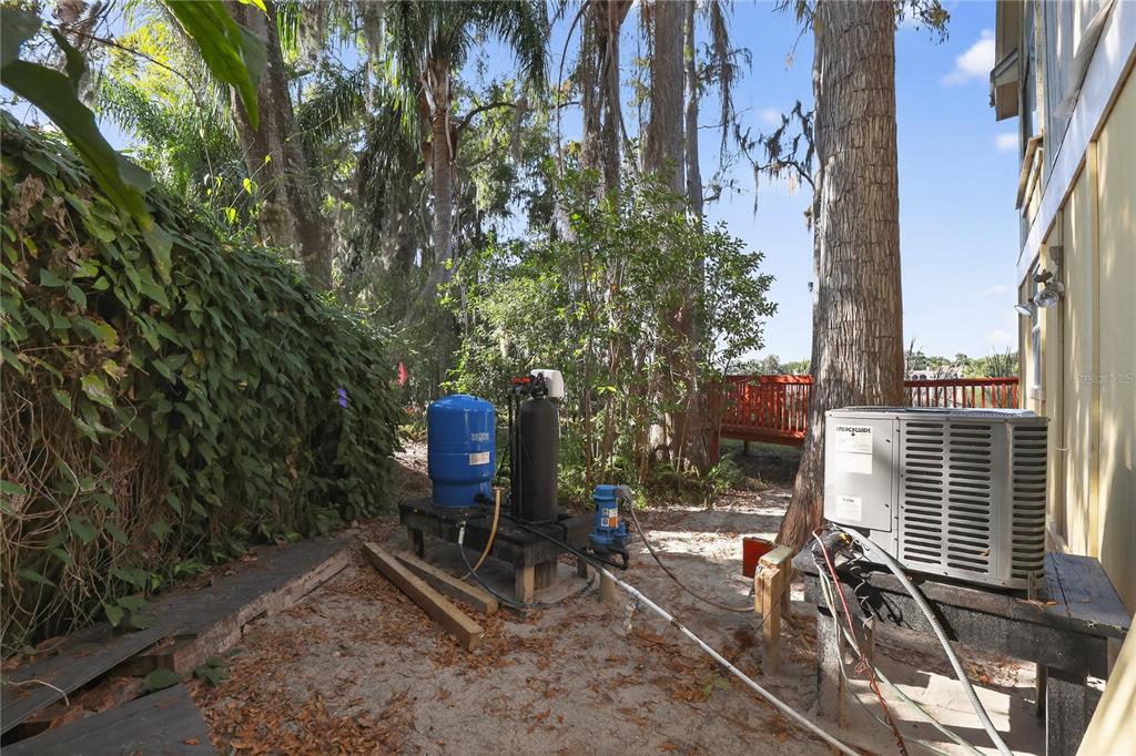 8111 North Mobley Road Odessa, FL 33556 - Photo 8 of 42 a view of a patio with chairs and potted plants