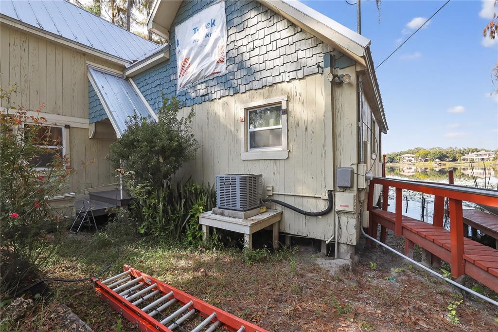 8111 North Mobley Road Odessa, FL 33556 - Photo 10 of 42 a backyard of a house with barbeque oven table and chairs