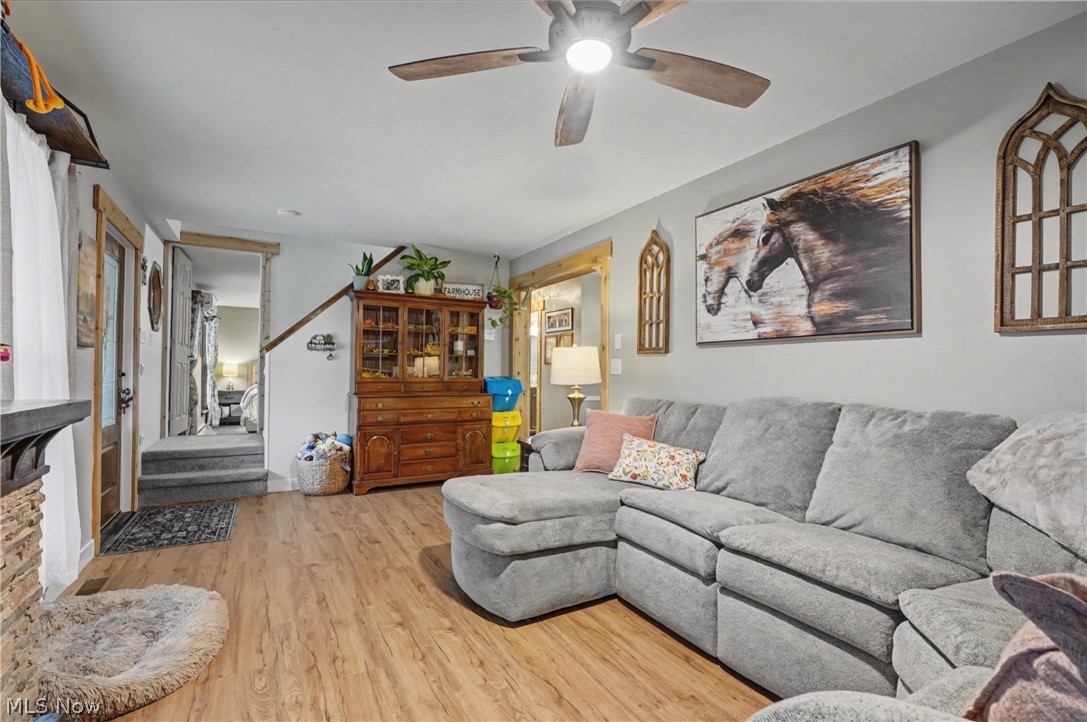 4556 Rootstown Road Ravenna, OH 44266 - Photo 8 of 50 Living room featuring light wood-type flooring and a ceiling fan