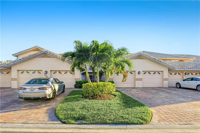 a view of a car parked in front of a house