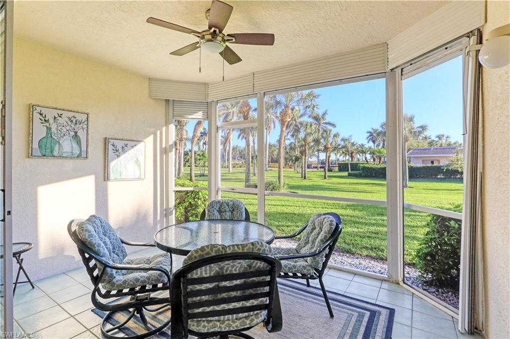 9022 Michael Circle, Unit 2205 Naples, FL 34113 - Photo 3 of 26 a view of a dining room with furniture window and outside view