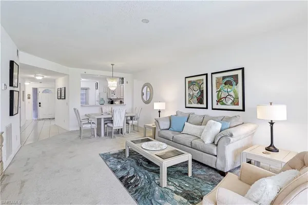 a living room with furniture and a table