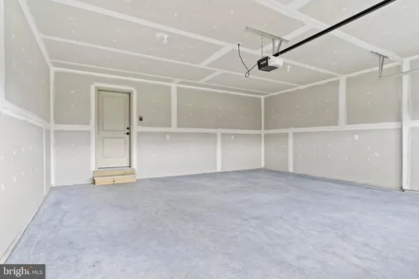 an empty room with shelves