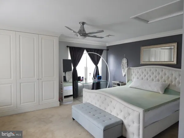a living room with a bed and furniture