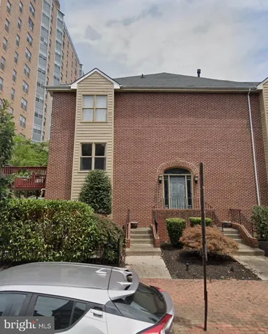 a front view of a house with stairs