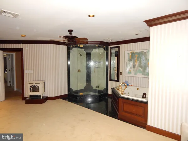 a bedroom with a bed and a mirror