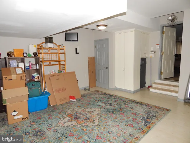 a view of a livingroom with storage & utility