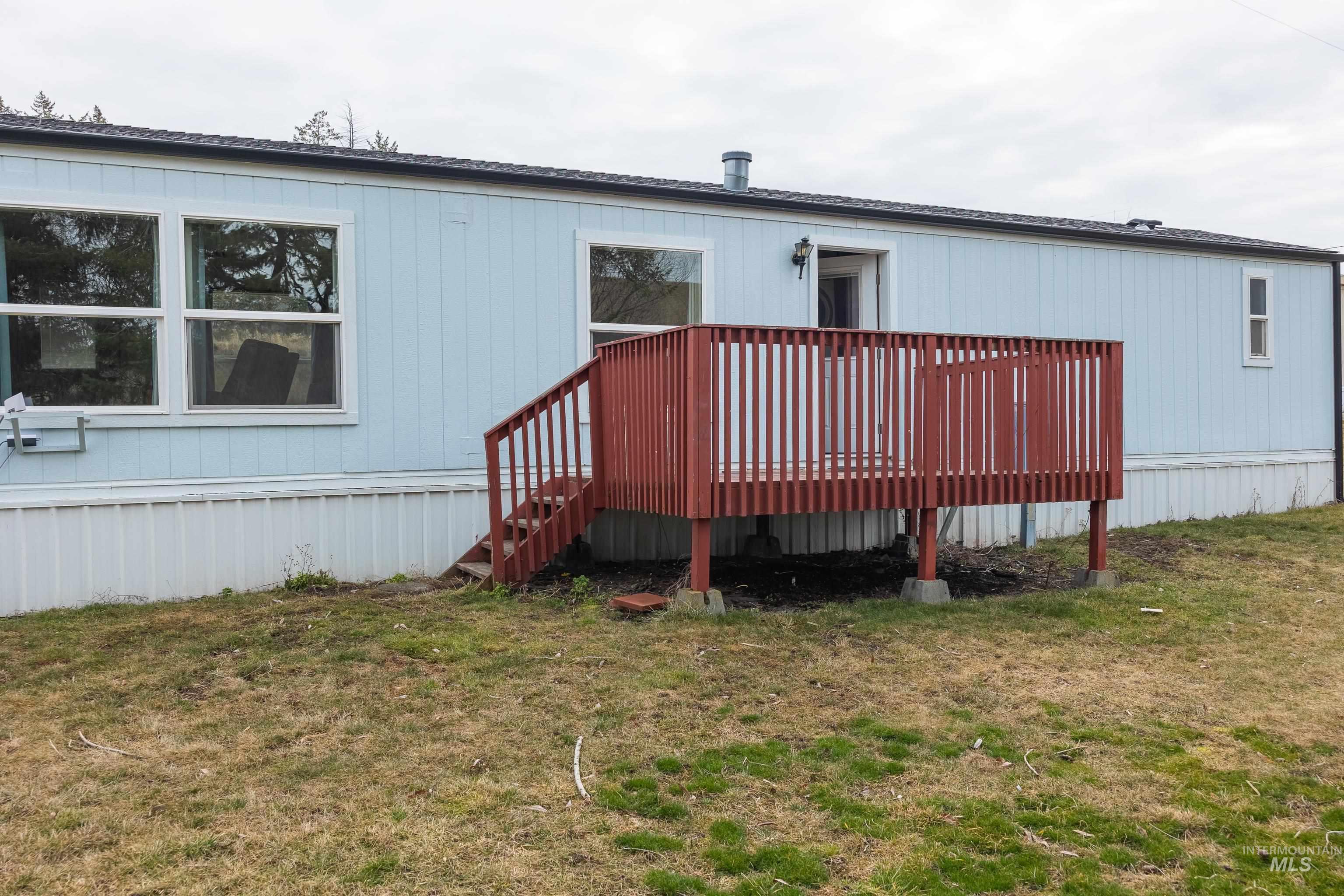 4325 Lenville Road, Unit 10 Moscow, ID 83843 - Photo 17 of 21 Rear view of property featuring a deck and a yard