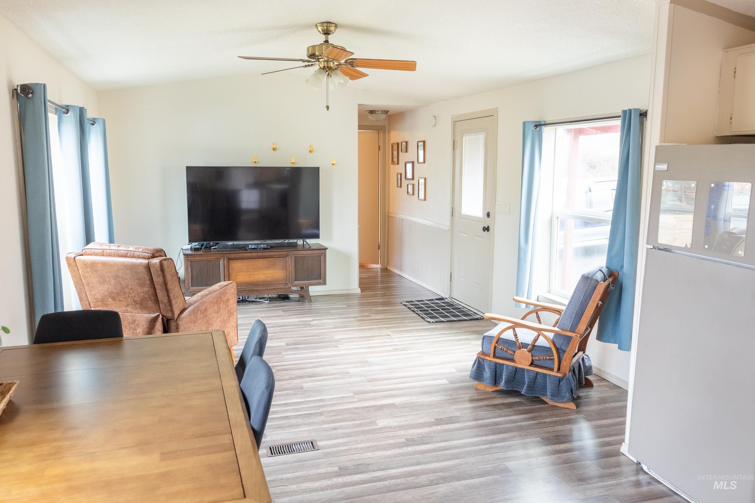4325 Lenville Road, Unit 10 Moscow, ID 83843 - Photo 8 of 21 Living area with wood finished floors, ceiling fan, and lofted ceiling