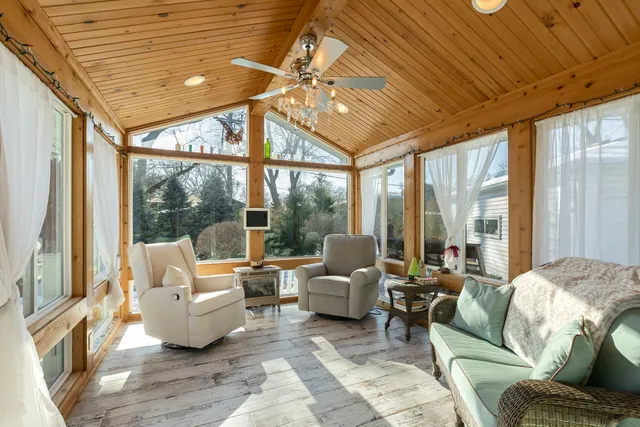 a bedroom with furniture and a window