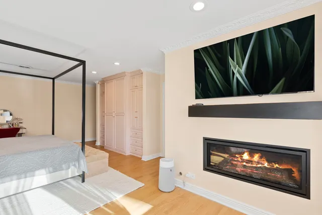 a bedroom with furniture and a large mirror