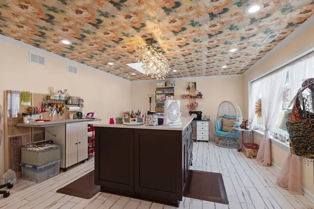 a bedroom with a bed table and a window