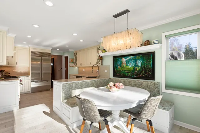 a dining room with furniture and window