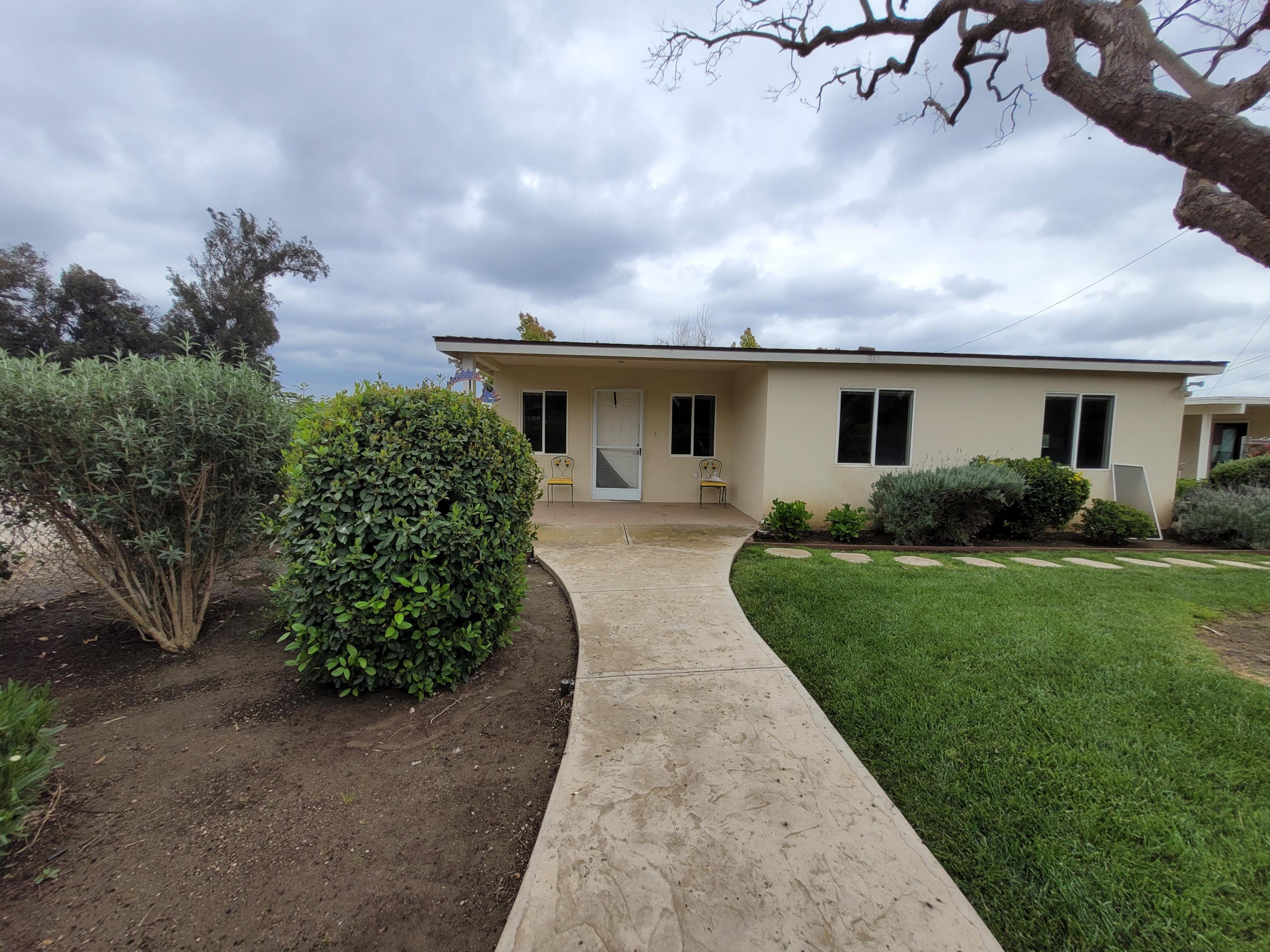 8614 Stockton Road Moorpark, CA 93021 - Photo 3 of 13 a view of a house with backyard and garden