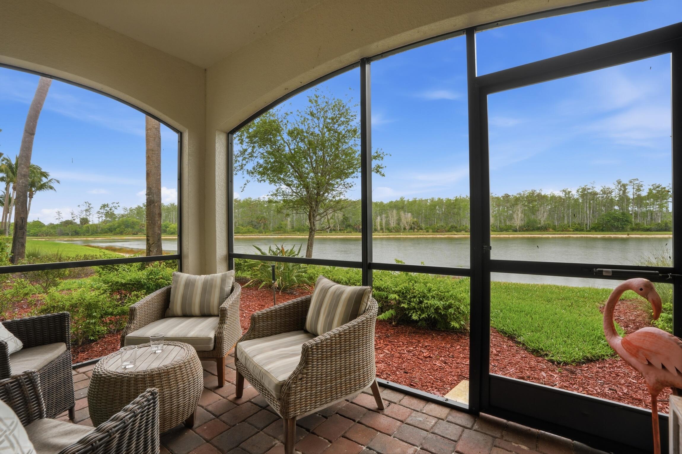9560 Trevi Court, Unit 4812 Naples, FL 34113 - Photo 11 of 45 a balcony with furniture and a view of lake