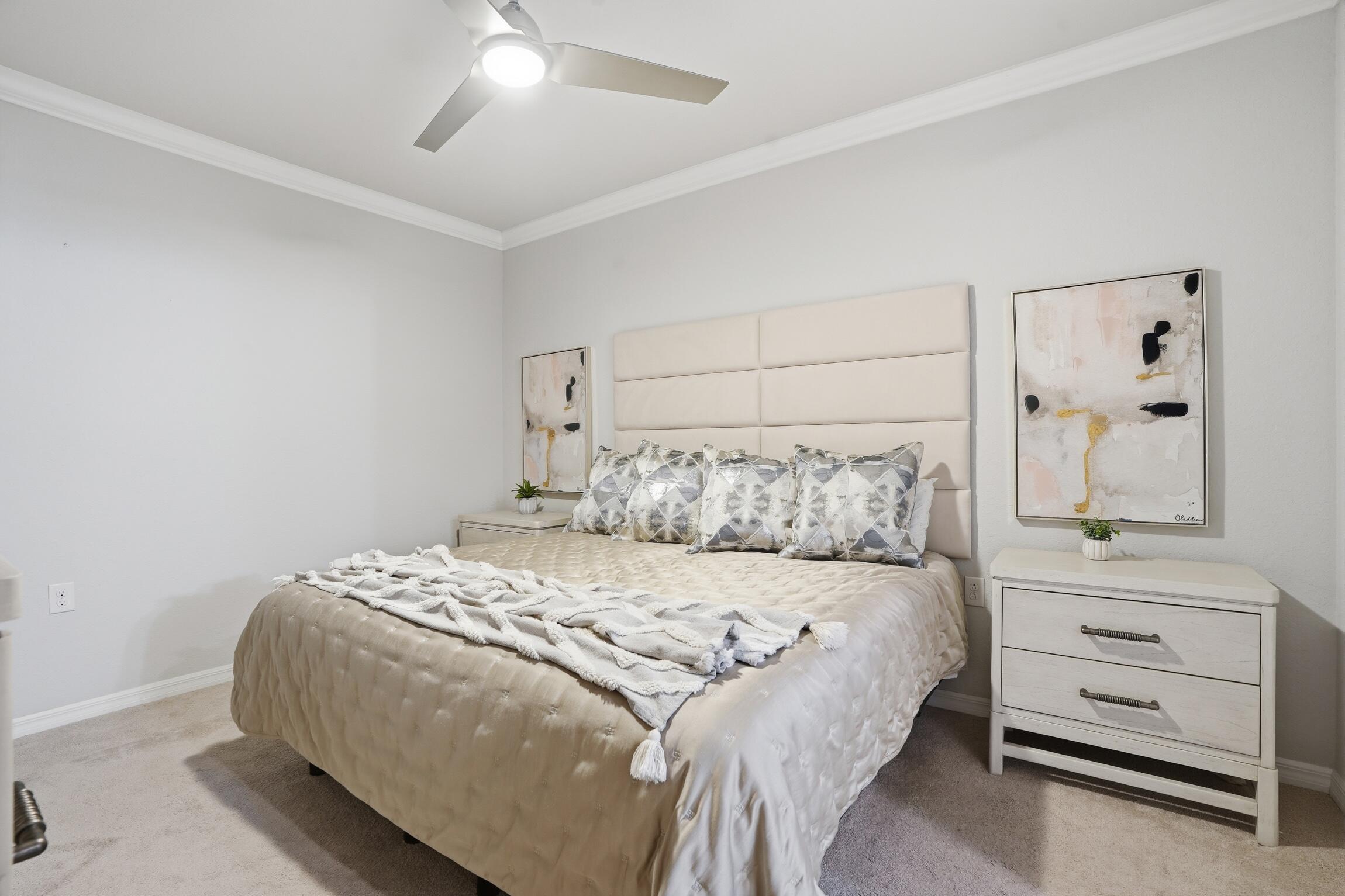 9560 Trevi Court, Unit 4812 Naples, FL 34113 - Photo 13 of 45 a bedroom with a bed and a dresser