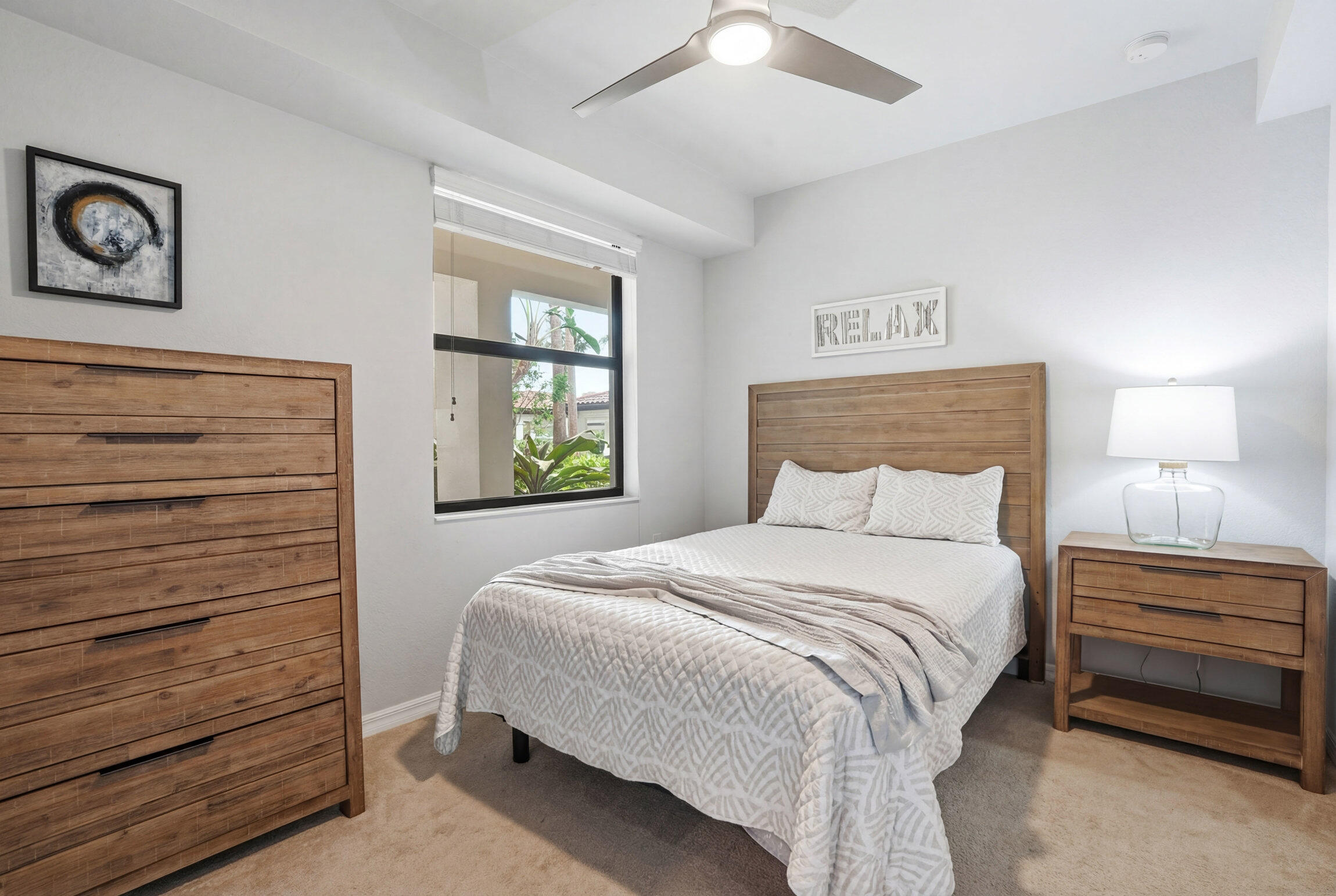 9560 Trevi Court, Unit 4812 Naples, FL 34113 - Photo 17 of 45 a bedroom with a bed and a window