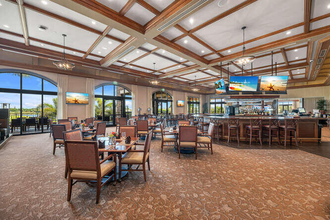9560 Trevi Court, Unit 4812 Naples, FL 34113 - Photo 22 of 45 a view of a bar restaurant
