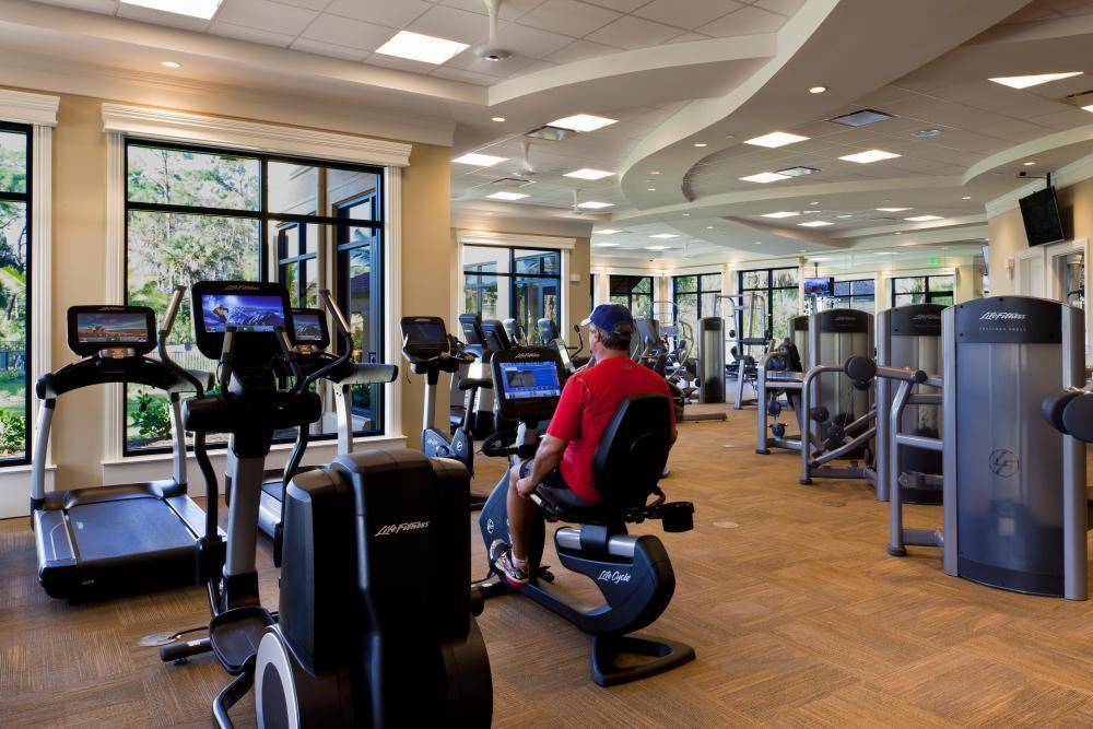 9560 Trevi Court, Unit 4812 Naples, FL 34113 - Photo 36 of 45 a view of a room with gym equipment