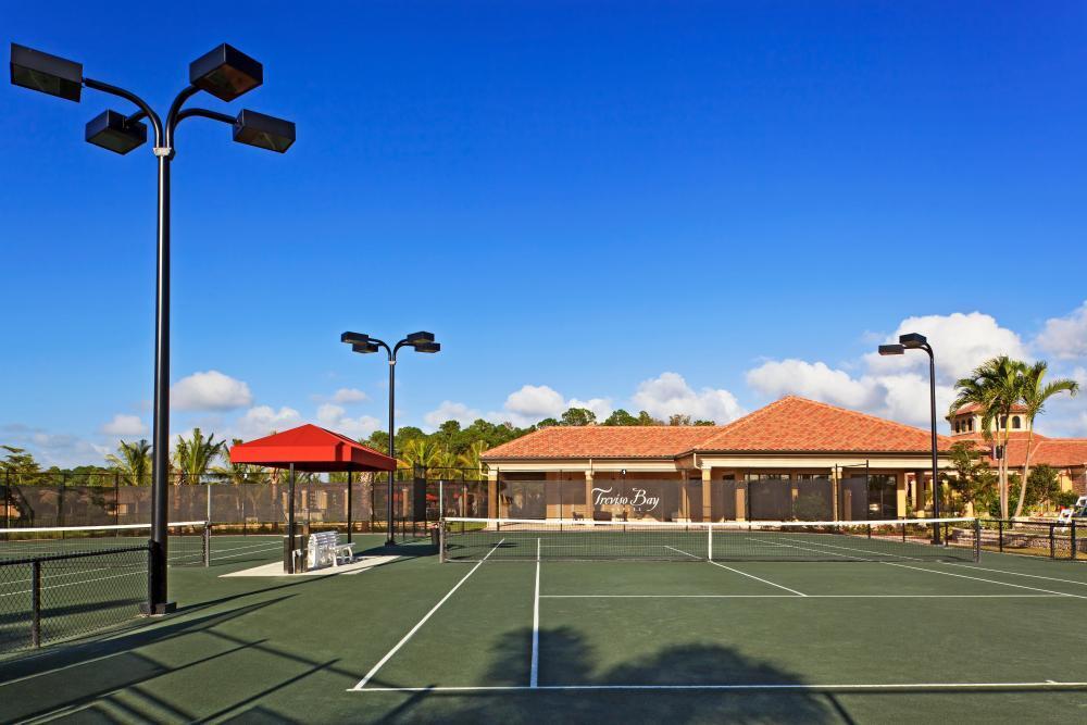 9560 Trevi Court, Unit 4812 Naples, FL 34113 - Photo 42 of 45 a view of a white building with a swimming pool