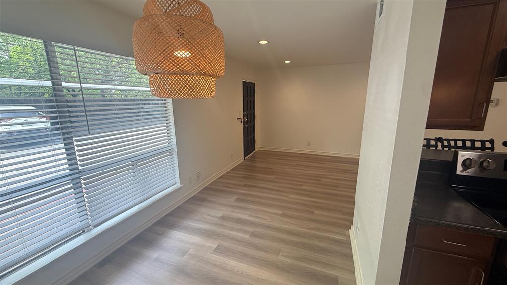500 East Riverside Drive, Unit 132 Austin, TX 78704 - Photo 6 of 31 a view of hallway with wooden floor