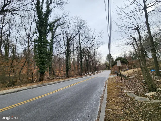 a view of road with a building in the background