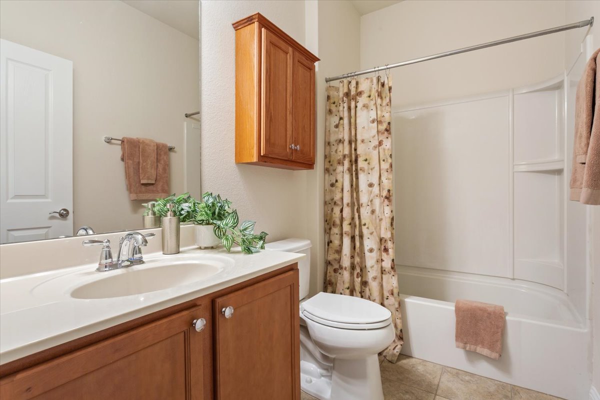 108 Cathedral Mountain Pass Georgetown, TX 78633 - Photo 29 of 36 a bathroom with a sink a toilet and shower