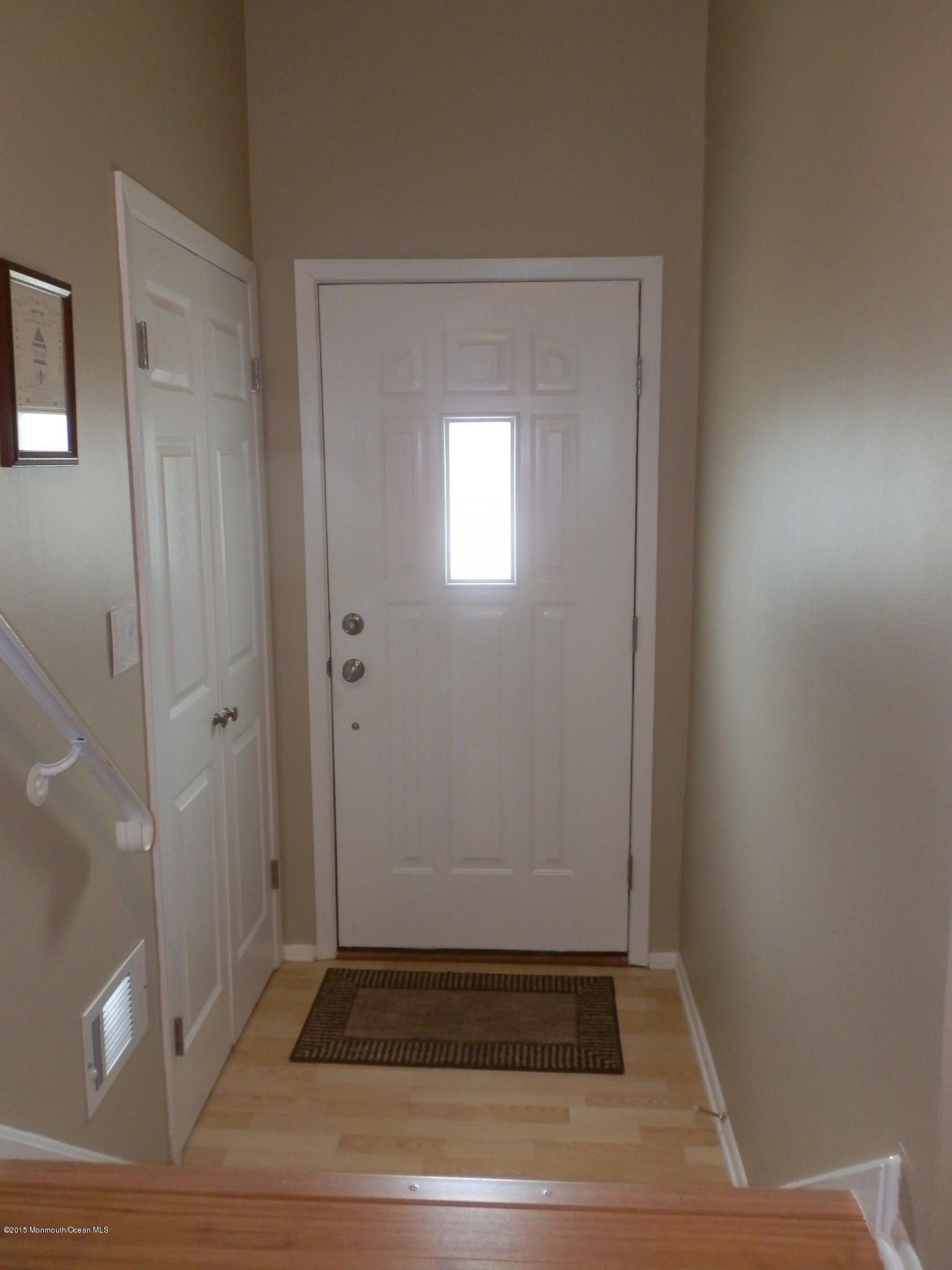 423 Middlewood Road Middletown, NJ 07748 - Photo 11 of 24 a view of an empty room with wooden floor and a window