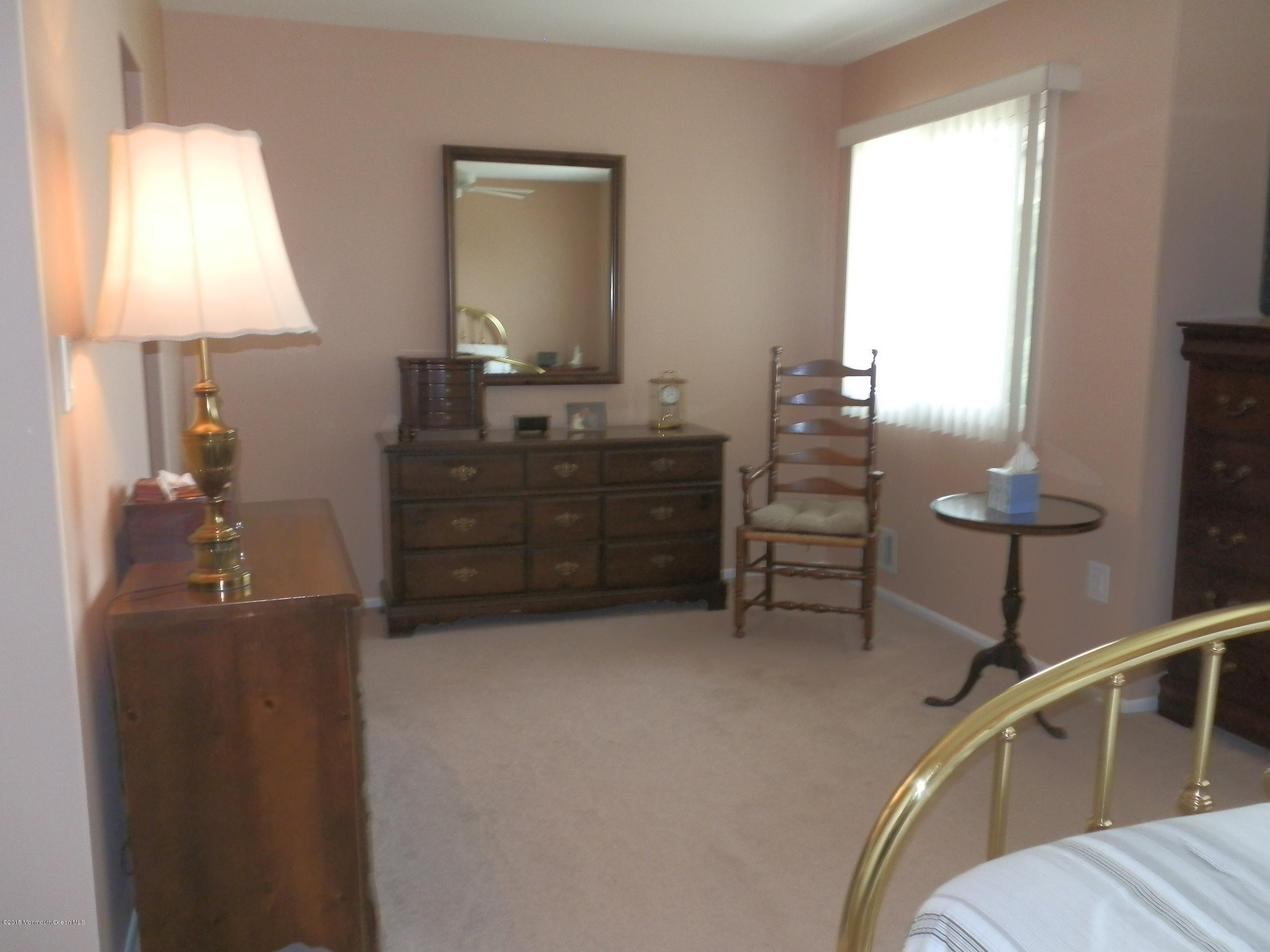 423 Middlewood Road Middletown, NJ 07748 - Photo 13 of 24 a room with furniture and a mirror