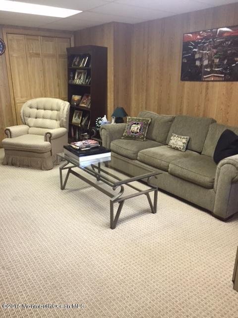 423 Middlewood Road Middletown, NJ 07748 - Photo 17 of 24 a living room with furniture and a couch