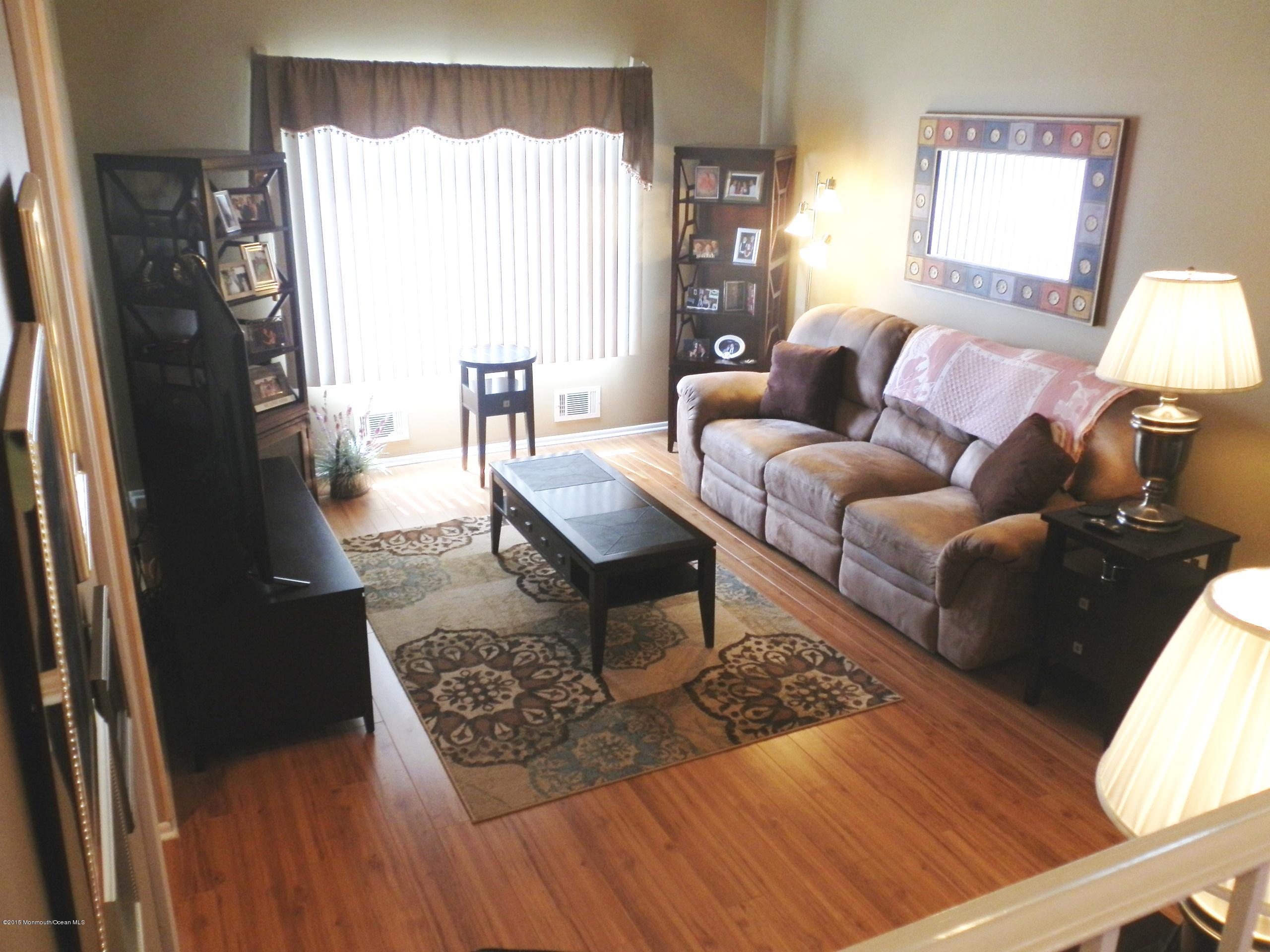 423 Middlewood Road Middletown, NJ 07748 - Photo 2 of 24 a living room with furniture and a window