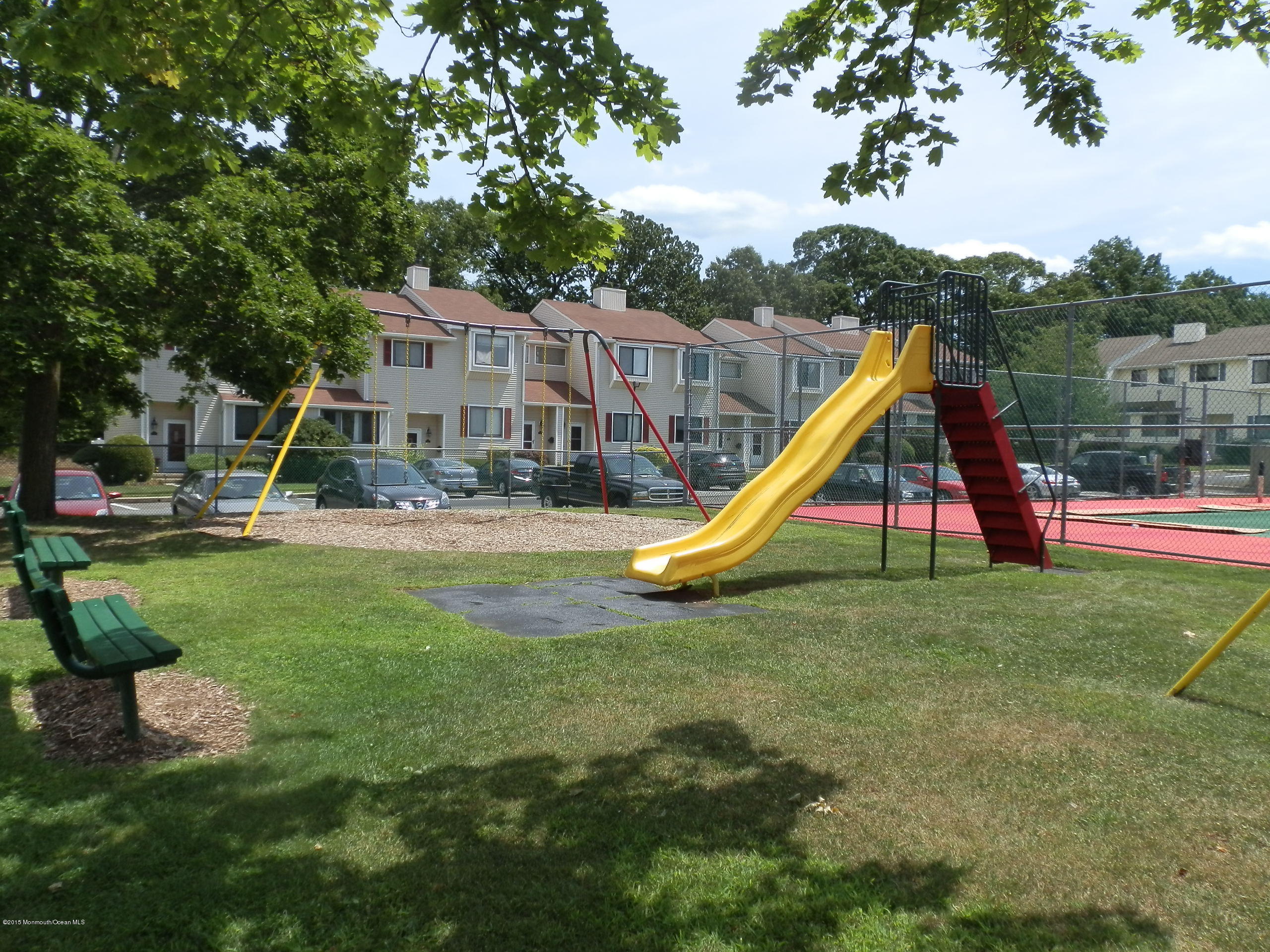 423 Middlewood Road Middletown, NJ 07748 - Photo 22 of 24 a view of a park with slide