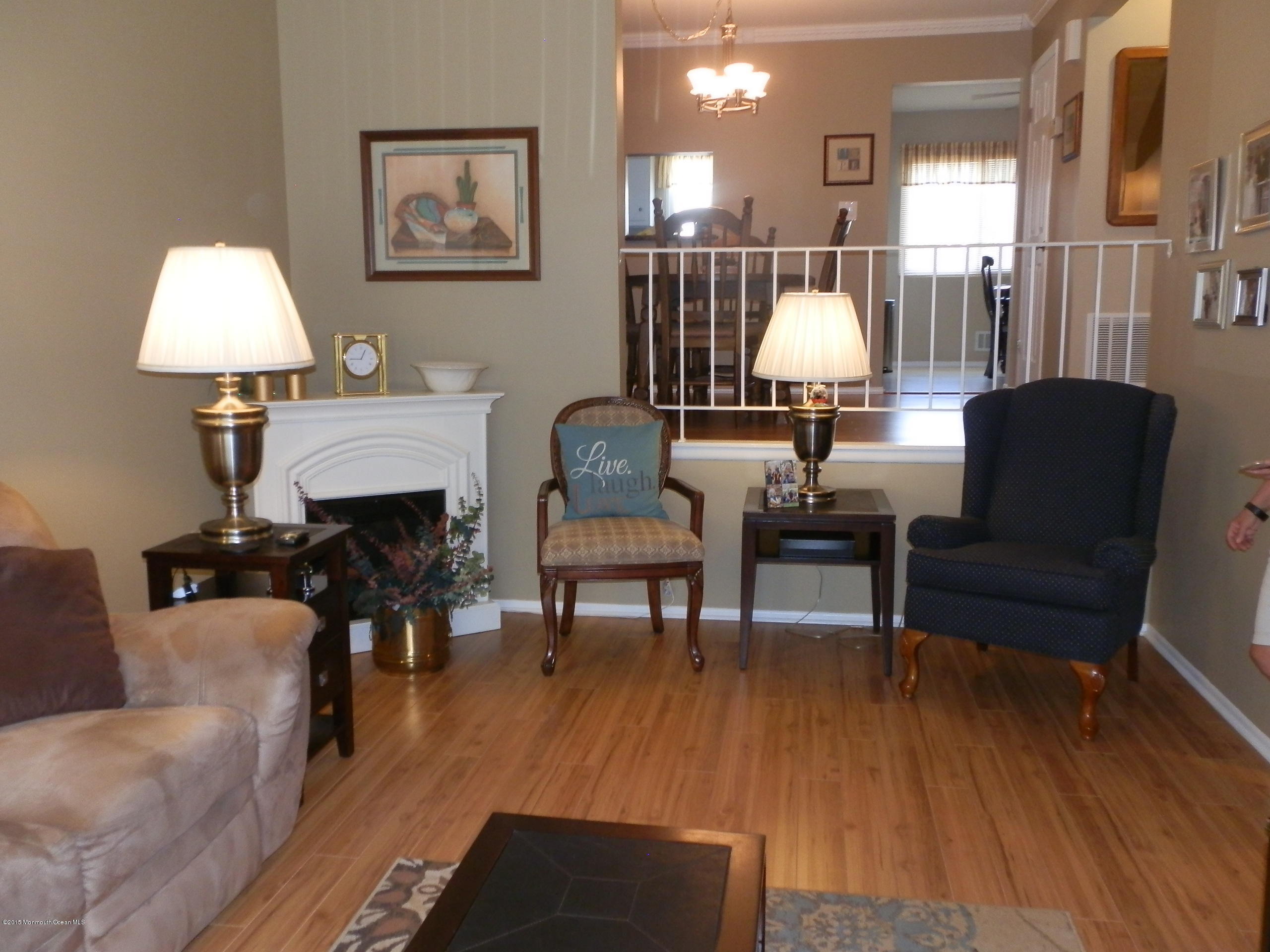 423 Middlewood Road Middletown, NJ 07748 - Photo 4 of 24 a living room with furniture and a lamp