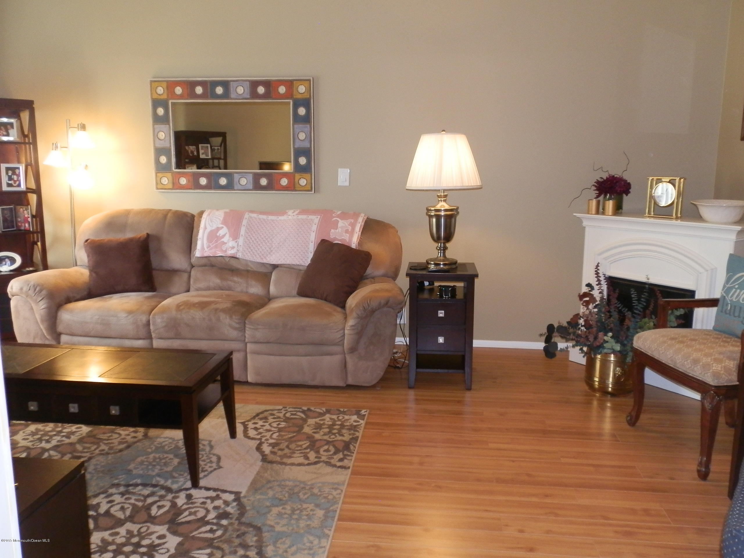 423 Middlewood Road Middletown, NJ 07748 - Photo 5 of 24 a living room with furniture and a fireplace