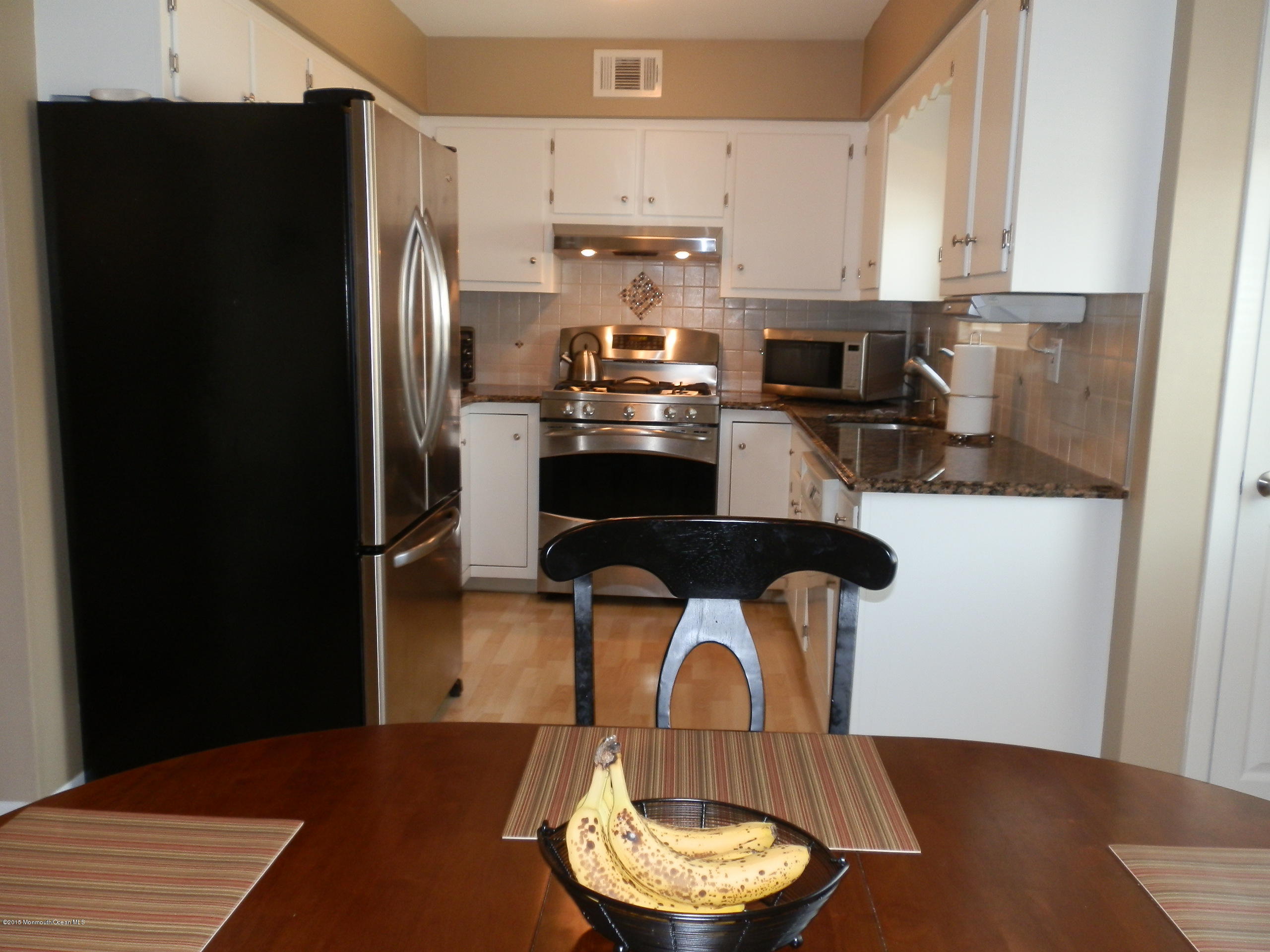 423 Middlewood Road Middletown, NJ 07748 - Photo 7 of 24 a kitchen with stainless steel appliances a refrigerator a stove a sink and a stove