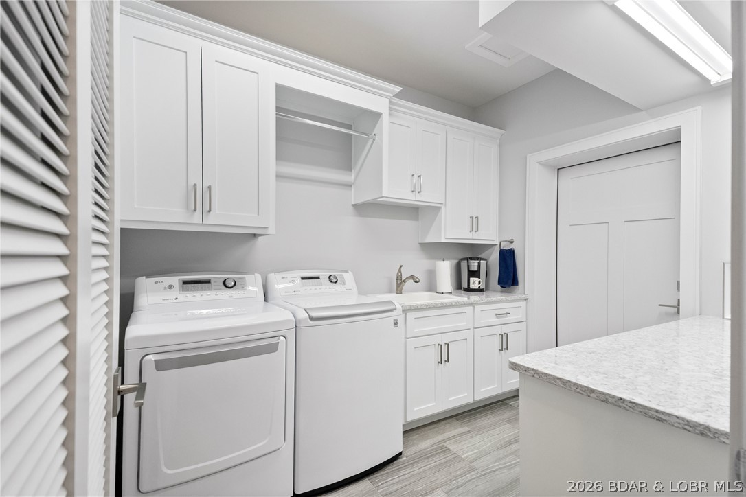 777 Malibu Road Osage Beach, MO 65065 - Photo 67 of 100 Spacious laundry room featuring a built-in folding