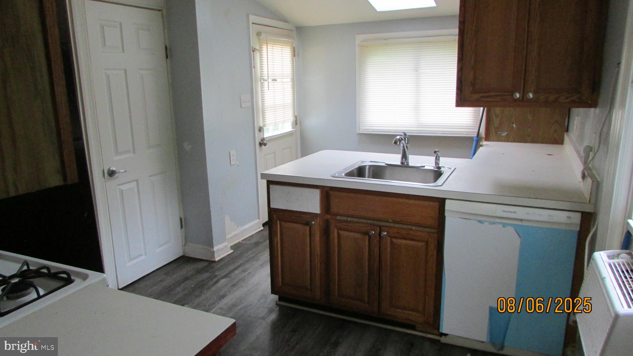 4724 Branchville Road College Park, MD 20740 - Photo 13 of 41 a kitchen with a sink stove and cabinets
