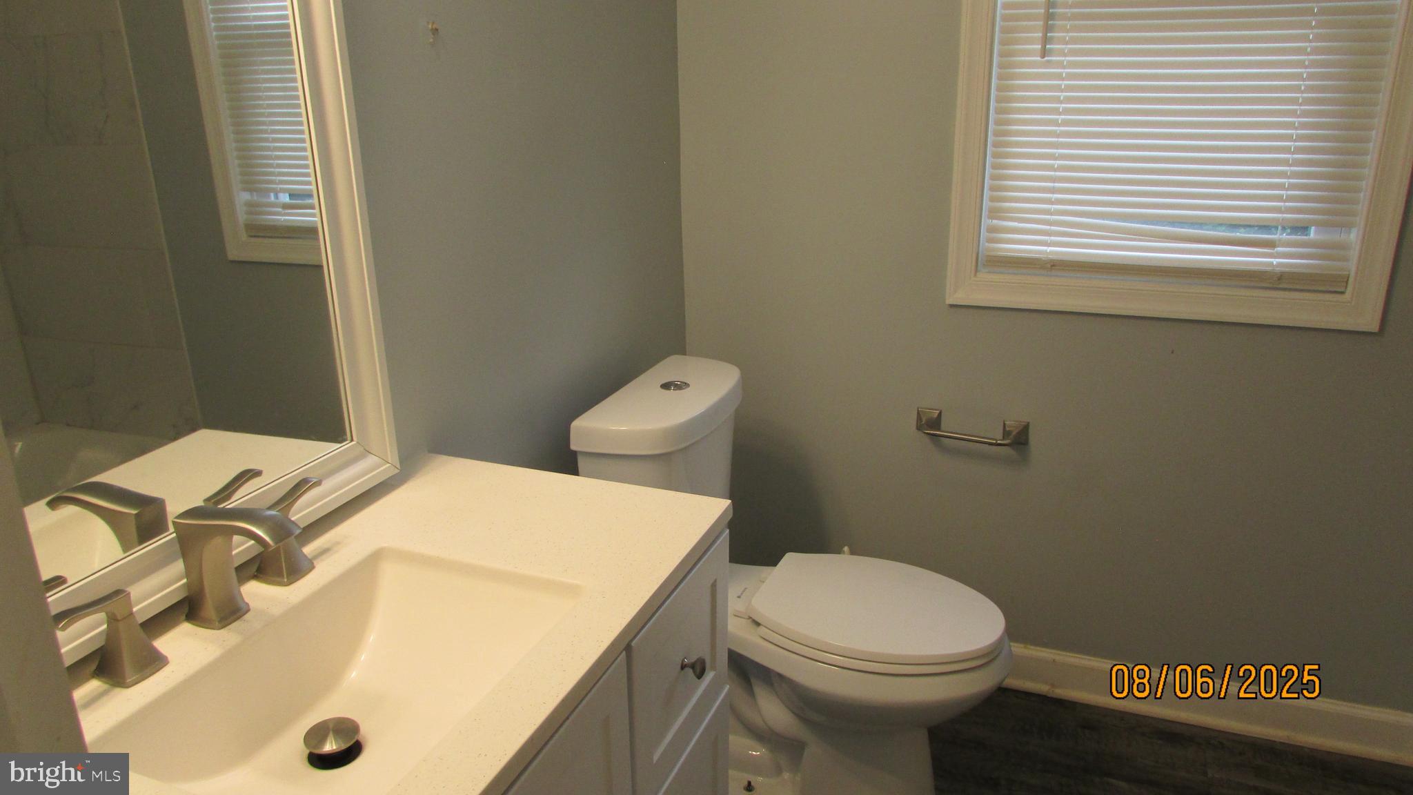 4724 Branchville Road College Park, MD 20740 - Photo 17 of 41 a bathroom with a sink and a toilet