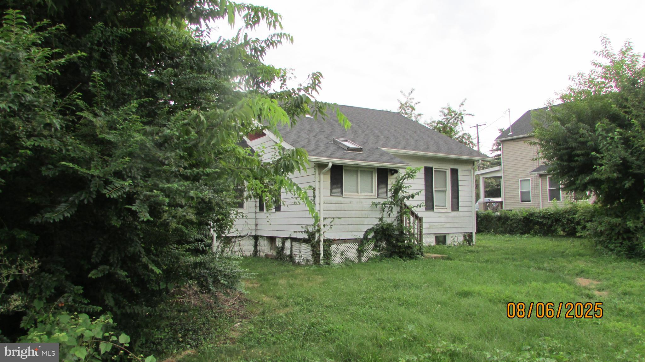 4724 Branchville Road College Park, MD 20740 - Photo 3 of 41 a front view of house with a garden and patio