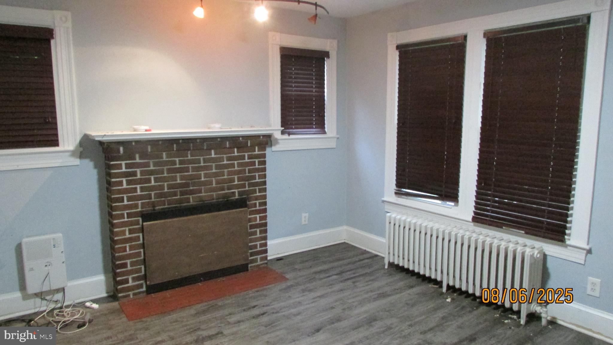 4724 Branchville Road College Park, MD 20740 - Photo 8 of 41 a view of an empty room with wooden floor and a window