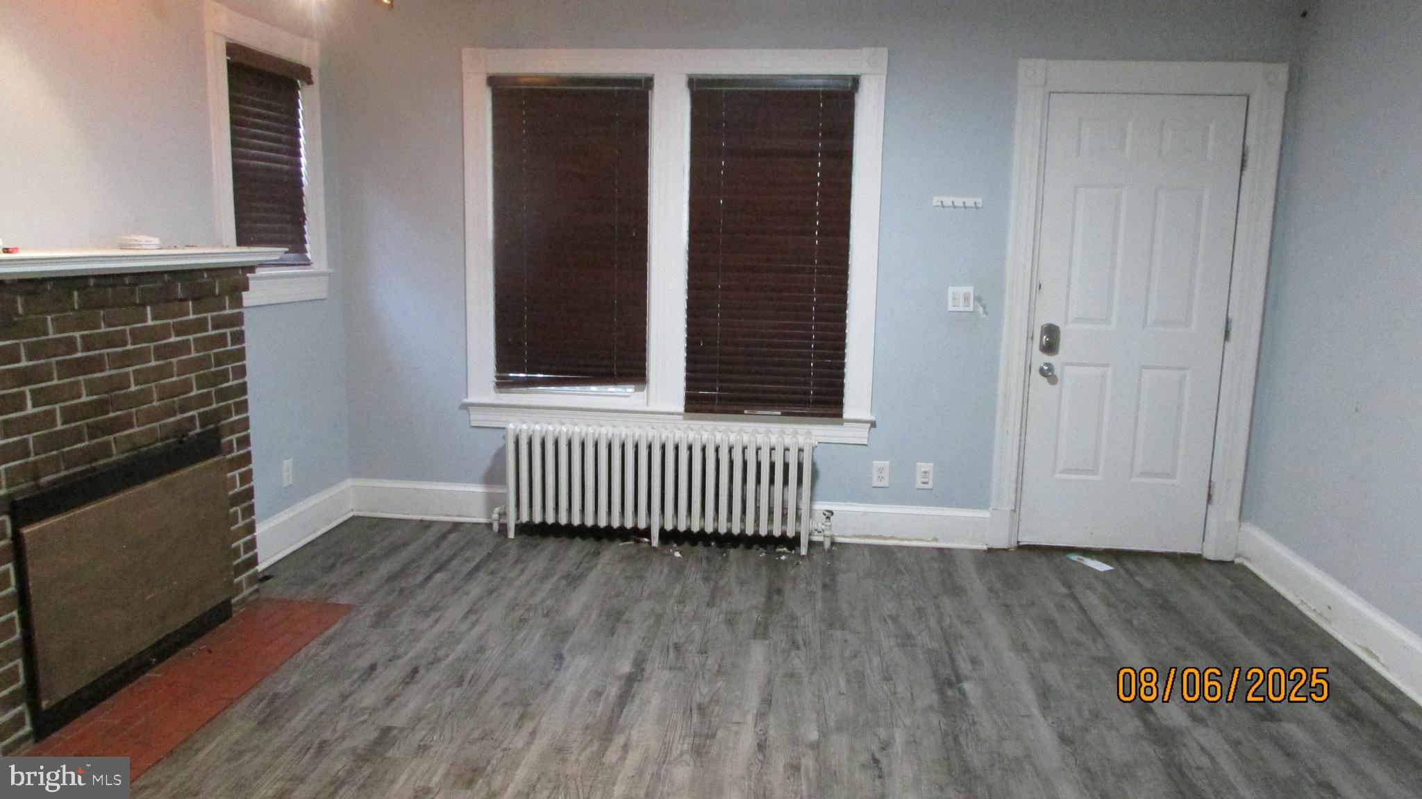 4724 Branchville Road College Park, MD 20740 - Photo 10 of 41 an empty room with wooden floor and windows